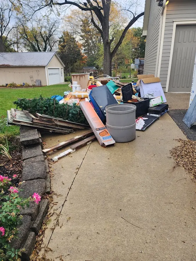 Dumpster being loaded with debris for Estate Cleanout Dumpster Rental in Westway